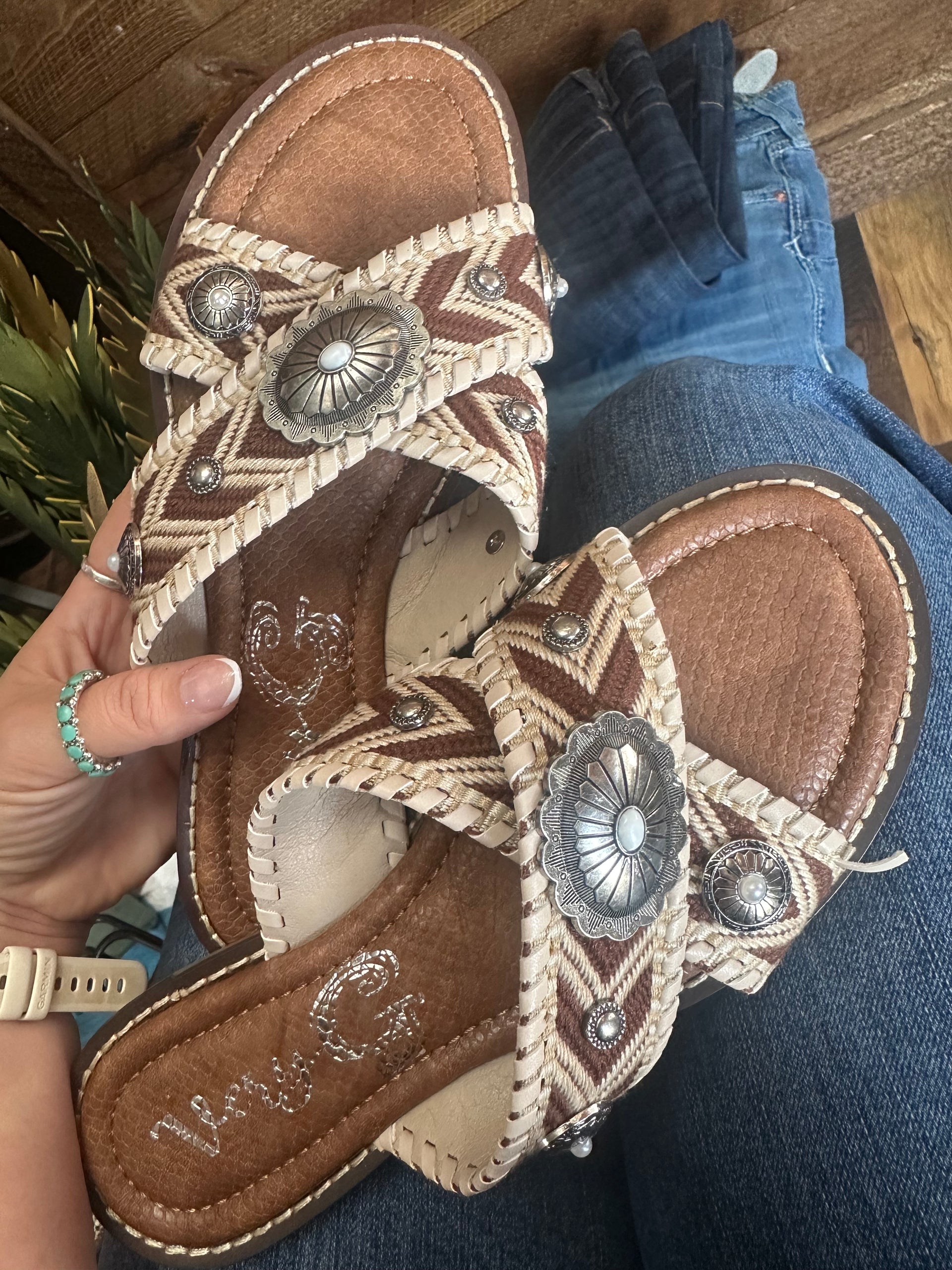 Size 8.5 never worn has small flaw that can be glued